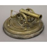 A small brass model of a cannon. 8.5 cm high.
