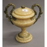 A gilt metal mounted twin handled urn. 29 cm high.