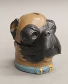 A dog's head form bronze ink well. 8.5 cm high.