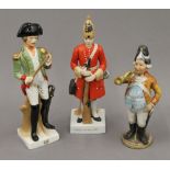 Three Continental porcelain models of soldiers. The largest 21 cm high.