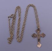 A 9 ct gold crucifix on a 9 ct gold chain. The crucifix 2.5 cm high. 2.