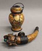 A Chinese opium jar and decorative ornate pipe. The former 13.5 cm high.