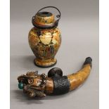 A Chinese opium jar and decorative ornate pipe. The former 13.5 cm high.