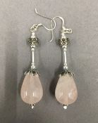 A pair of rose quartz and marcasite earrings. 4 cm high.