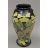 A large modern Moorcroft Hypericum pattern vase. 25.5 cm high.