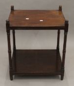 A 19th century mahogany two tier whatnot. 59.5 cm high.