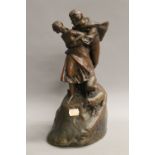 A late 19th/early 20th century patinated bronze figural group, indistinctly signed. 33 cm high.