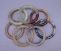 A collection of various jade bangles.