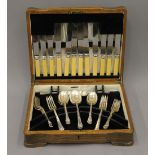 A canteen of plated cutlery. 34 cm wide.