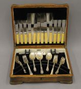 A canteen of plated cutlery. 34 cm wide.