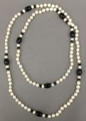 A dress necklace. 138 cm long.