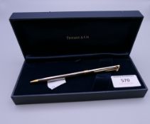 A boxed Tiffany & Co propelling pencil. The pencil 13 cm long.