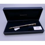 A boxed Tiffany & Co propelling pencil. The pencil 13 cm long.