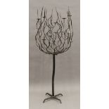 A modern wrought iron standing candelabra. 165 cm high.