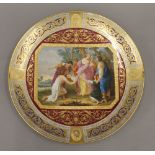 A 19th century Vienna gilt heightened and painted porcelain plate,