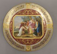 A 19th century Vienna gilt heightened and painted porcelain plate,