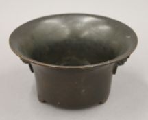 An 18th century Chinese patinated bronze censor of flared form,