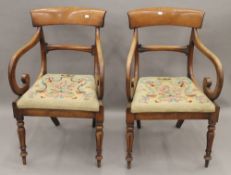 A pair of 19th century mahogany open armchairs. 52 cm wide.
