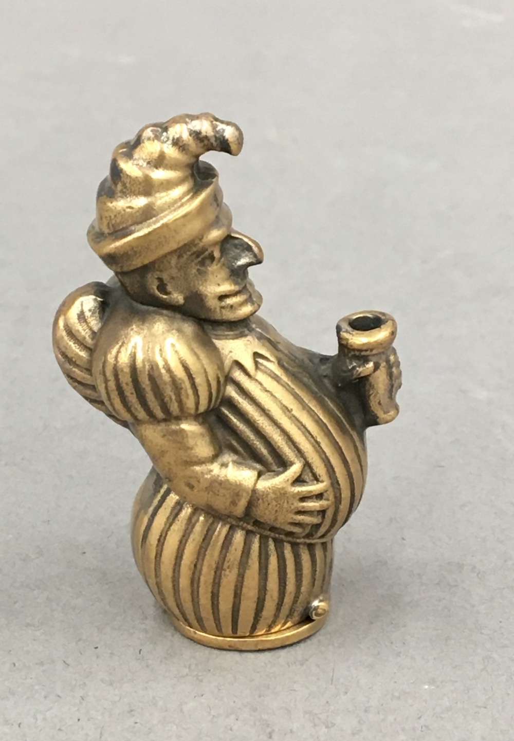 A brass vesta formed as Mr Punch. 5 cm high. - Image 2 of 3