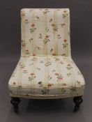 A Victorian upholstered nursing chair. 79 cm high.