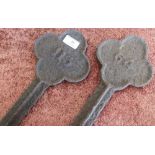 Pair of early cast metal number marker pegs