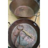 Two large twin handled copper pans, pair of sugar nips and a pastry cutter (4)