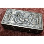 Indian white metal rectangular table box with hinged top, decorated with various deities and dancing