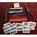 Box containing a quantity of various railway related pencils, pens, cigarette cards, ticket
