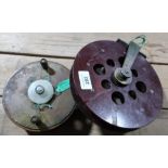 Two vintage Scarborough reels, one in wood and one Bakelite