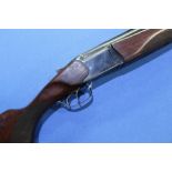 Baikal 12 bore over & under shotgun with 28 1/2 inch barrels, double trigger action and 14 1/4