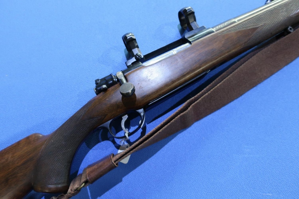 Cogswell and Harrison .375 H & H bolt action rifle, fitted with scope ring mounts and leather and