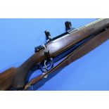 Cogswell and Harrison .375 H & H bolt action rifle, fitted with scope ring mounts and leather and