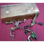 Vintage mahogany box containing four various vintage shotgun cartridge turnover tools