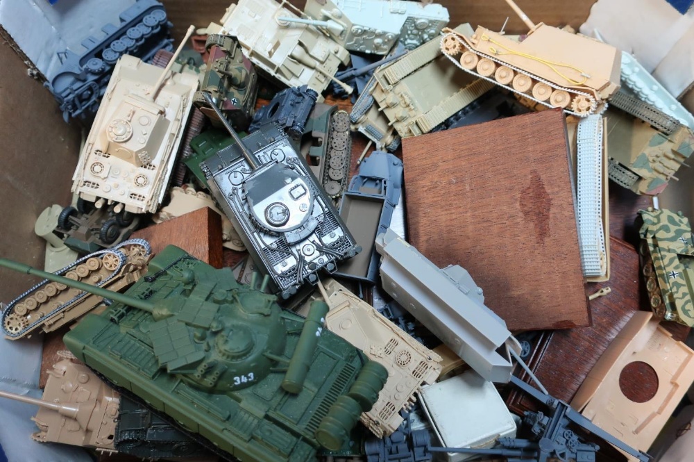 Box containing a quantity of various military model vehicles, mostly tanks, armoured vehicles etc