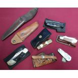 Selection of various leather knife sheaths, small leather holster and various pocket knives