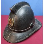 Leather covered fireman's helmet, the front marked FMB within laurel, the inside complete with