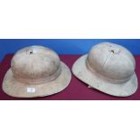 British military issue pith helmet complete with leather liner and chin strap, the liner stamped 6