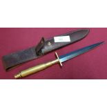 Unusual Commando style knife with 7 inch double edged blackened stiletto type blade with brass