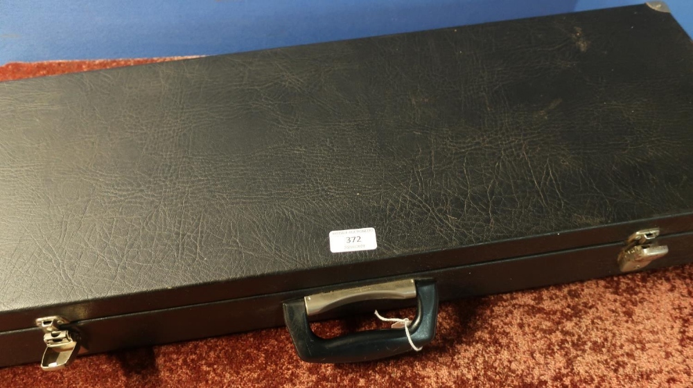 Black Rexine gun case with fitted interior for two sets of 30 inch barrels