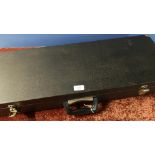 Black Rexine gun case with fitted interior for two sets of 30 inch barrels