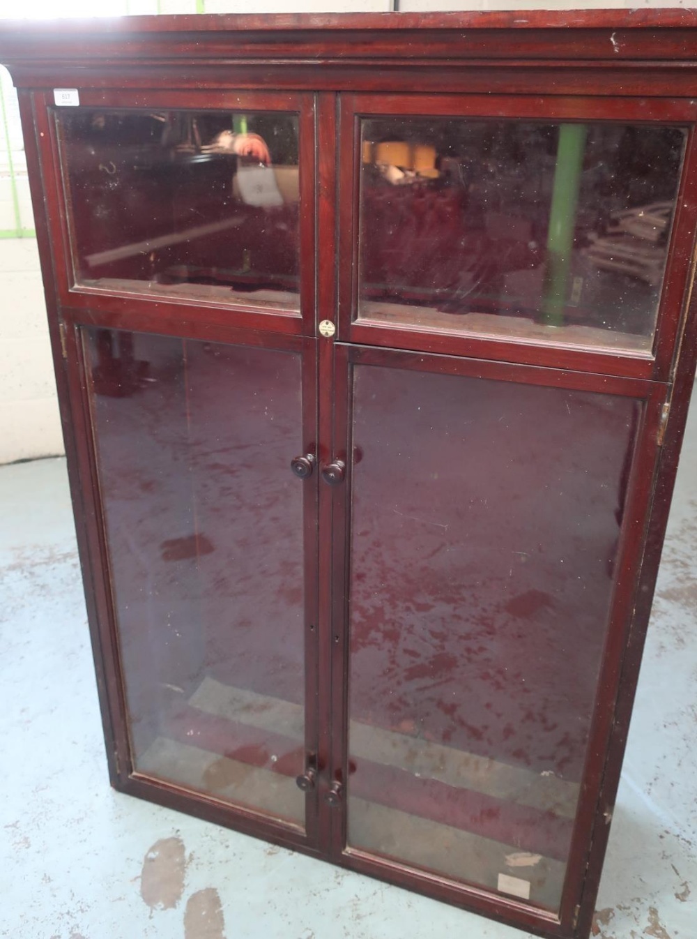 Early 20th C mahogany cased sectional gun cabinet with two glazed panels above two glazed cupboard