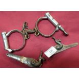 Pair of British Steel handcuffs and two percussion cap gun locks