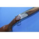 Boxed left handed Silma 12 bore over & under ejector shotgun with 28 inch barrels with multi-chokes,