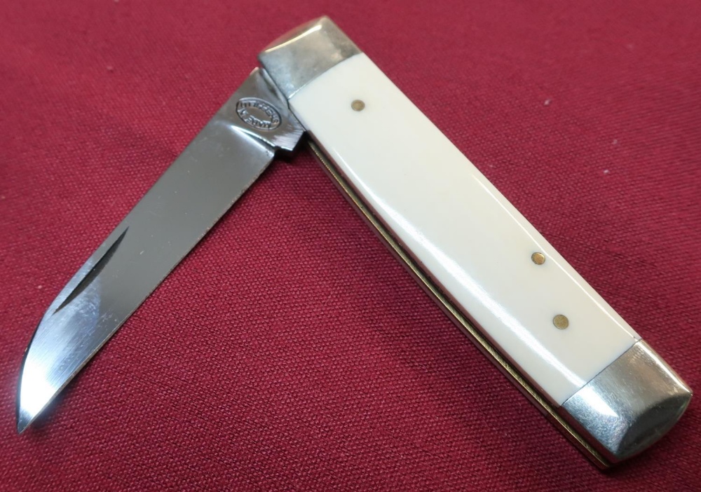 Sheffield made pocket knife with 2 1/4 inch blade, two piece ivory grips and working back detail