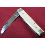 Sheffield made pocket knife with 2 1/4 inch blade, two piece ivory grips and working back detail