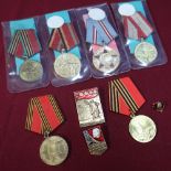 Group of six Soviet Russian medals and three Russian badges including USSR Medal Celebrating 60