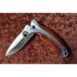 Boxed as new Elk Ridge pocket knife with folding blade and belt clip
