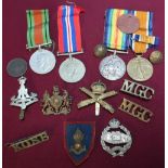 Group of various military cap badges and shoulder titles including Green Howards, Princess of