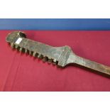 Unusual tribal style club, the unusual formed head with various carved detail and teeth type design,