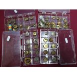 Four cases of various assorted military and other buttons including Victorian and later, various